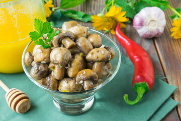 Marinated champignons with honey, vinegar and chili pepper