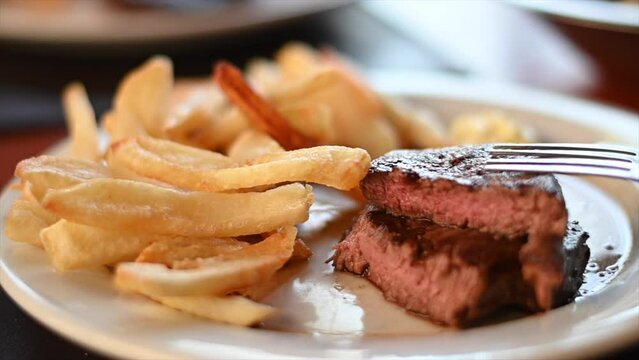 Argentinian beef bide ready with fries in a restaurant