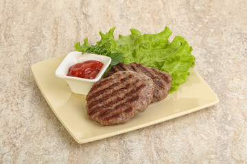 Grilled beef burger cutlet with sauce