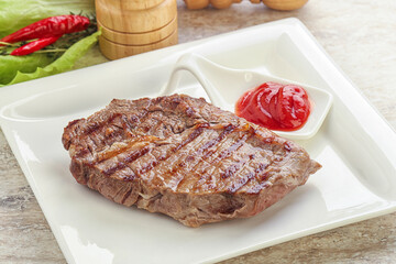 Grilled rib-eye steak beef meat