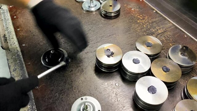 Worker manufactures rubber and polymer sealing elements and oil seals