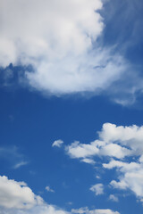 Naklejka na ściany i meble Blue sky with feathery clouds, blue natural background