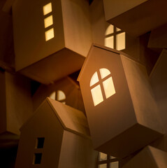 Bright evening light from the window of a decorative house, creating a fairy-tale atmosphere