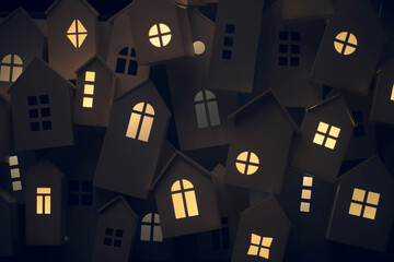 yellow light from the windows of small decorative houses on the city street