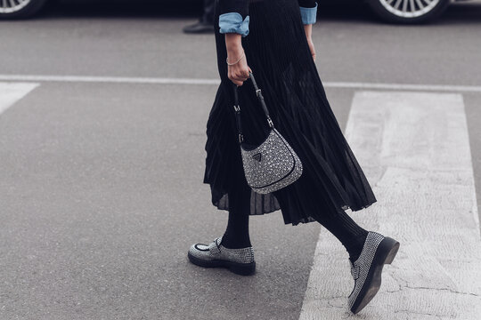Street style, woman wearing Prada: silver Cleo handbag in detail.