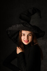 Portrait of a beautiful woman in a witch's hat