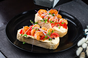 Italian sandwich bruschetta with shrimps served - obrazy, fototapety, plakaty