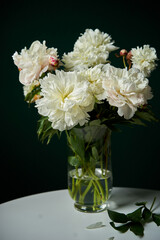 white peonis in a vase