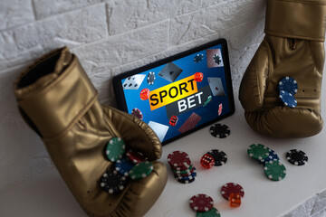 boxing gloves and smartphone with bets.