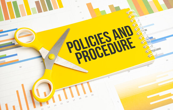 Policies And Procedure Word Written On Yellow Notebook And Charts