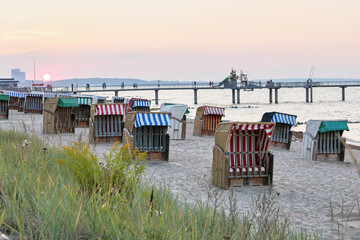 wicker chairs on the beach