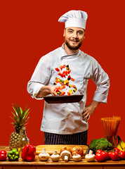 Cook with a frying pan and vegetables on a red background. Isolate