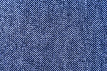 Classic blue woolen or tweed fabric for grunge background.