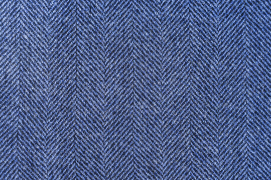 Classic blue woolen or tweed fabric for grunge background.