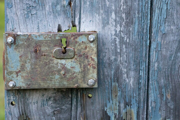 Antique old blue wood door and rusty lock photography which can be used as a background with some copy space 