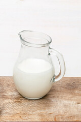 Bottle, jug, glass of organic homemade natural milk yogurt. Protein drink on kitchen table.Healthy and eco friendly diet