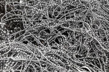 Steel shavings. Metal shavings after working on a milling machine or CNC machine. Industrial background. Metal shavings texture
