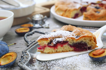 Homemade plum pie and cup of tea. New York Times recipe plum cake