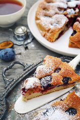 Homemade plum pie and cup of tea. New York Times recipe plum cake