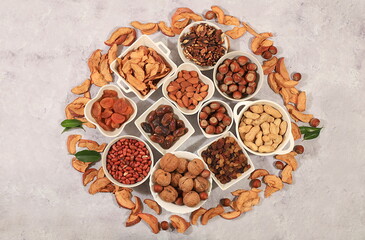 Assortment of various nuts and dried fruits, healthy natural food concept, almonds, nuts, pecans,...