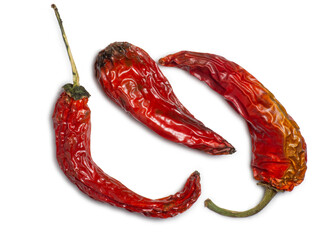 Bunch of dried red peppers on a white background. Spices for dishes. The concept of spicy food....