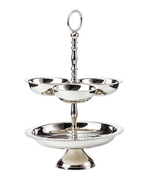Two tier cake stand over white background. Stainless steel fruit plate.