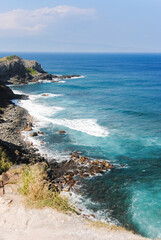 Fototapeta na wymiar High view of a rocky coastline at Maui, one of the Hawaiian islands