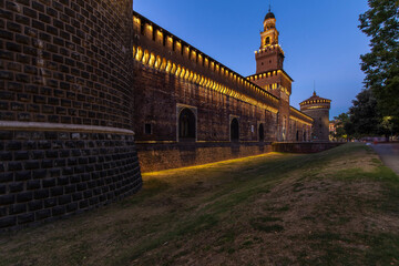 Milan, Italy - September 18, 2022: twilight in Piazza Castello, blue sky is turning dark over...