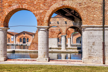 Fototapeta premium Venice, Italy - July 5, 2022: Building exteriors along the canals in Venice Italy 