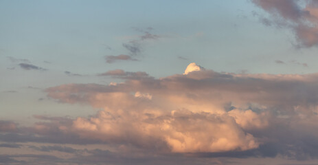 Puff Clouds in the Sky during sunset. Zoom in.