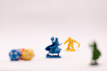 Role play game dices and figures of a mage and a dwarf