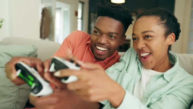 Happy gaming couple on video game console in the living room or home sofa for win, challenge and esport lifestyle. Excited gen z black people or gamer friends with online action and fun competition