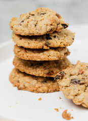 Freshly baked müsli and oatmeal raisin cookies, traditional American biscuits made of flour, rolled oats, oat meal, muesli, sugar, eggs, raisins or sultanas and baking soda or powder, chewy and soft - 531552623