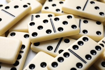 Set of classic domino tiles on white background, closeup