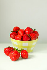 Fresh ripe juicy strawberries on white table