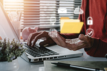 Document Management System DMS .Businessman hold folder and document icon on office desk, Virtual...