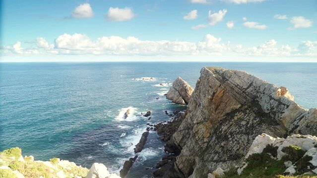 Seascape of Atlantic ocean and Asturias rocky coast at Cape Penas. Sea shore with high cliffs in north Spain.