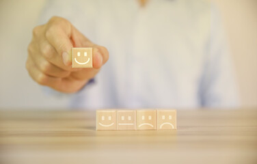 positive customer reviews Tap the wooden block, happiness icon and five-star smiley face.