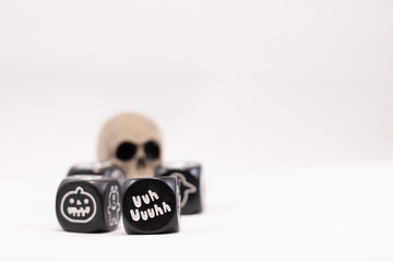 Magic dices with symbols for fantasy games and a skull