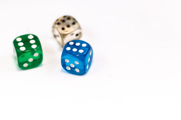 Transparent color plastic dices, green blue and white