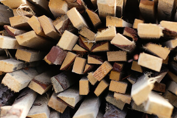 Defocus piles of wooden boards in the sawmill, planking. Warehouse for sawing boards on a sawmill outdoors. Wood timber stack of wooden blanks construction material. Out of focus