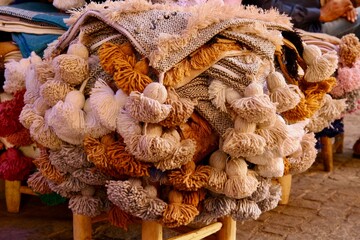 Pile of traditional cushion covers on the market of Marrakech 