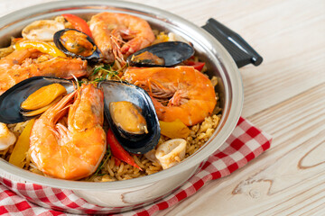 Seafood Paella with prawns, clams, mussels on saffron rice