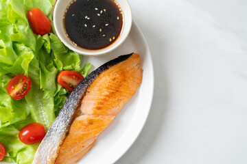 grilled salmon fillet steak with salad