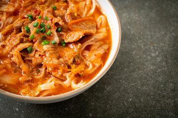Korean udon ramen noodles with pork in kimchi soup