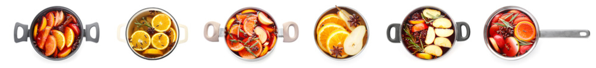 Many pots of tasty homemade mulled wine isolated on white, top view