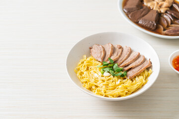 dried duck noodles in white bowl