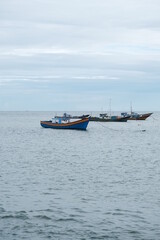 Fototapeta premium Several fishing boats are lined up in the sea