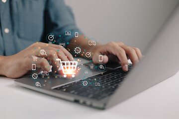 Concept of online purchasing and e-commerce using a laptop computer and a credit card, with a...