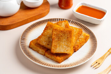 Turnip cake (Chinese : Chai tow kway ). Turnip cake  is a common dish or dim sum of Teochew cuisine in Chaoshan, China usually cut into rectangular slices and sometimes pan-fried before serving.